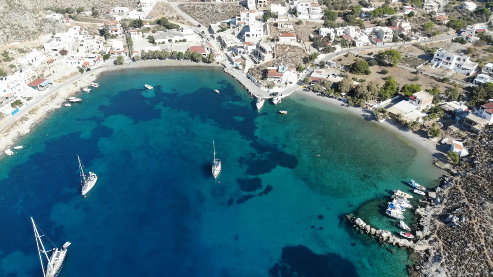 Aerial view of the bay of Vlychadia, Kalymnos, with its turquoise water and pebble beach